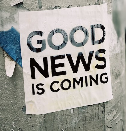 Sign with words good news is coming